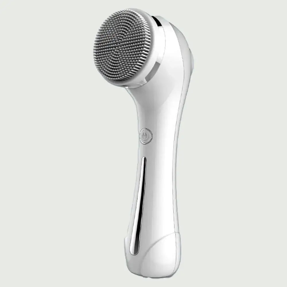 Front view of PureSpin Facial Cleansing Brush with EMS showing curved design, soft cleansing bristols and and power button.