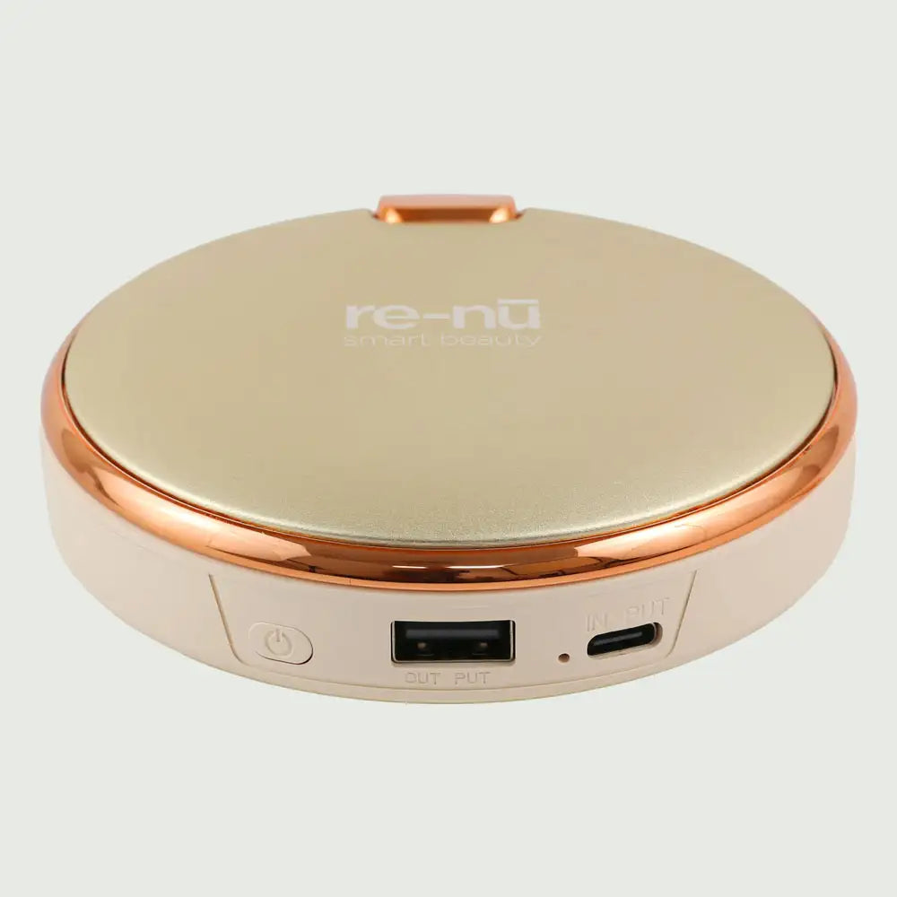 re-nū Smart Beauty 3-in-1 Rechargeable Hand Warmer & Power Bank – compact aluminum design in Beige finish.