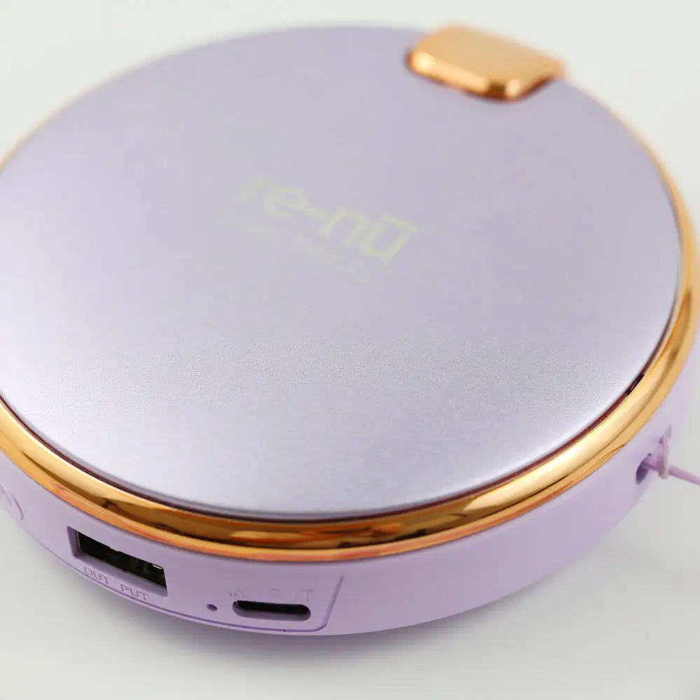 Close-up of re-nū 3-in-1 Hand Warmer showing USB output and USB-C input ports for dual power functions.