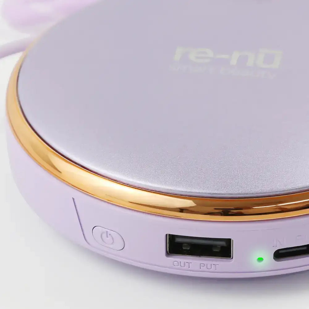 Close-up of re-nū 3-in-1 Hand Warmer showing USB output and USB-C input ports for dual power functions.