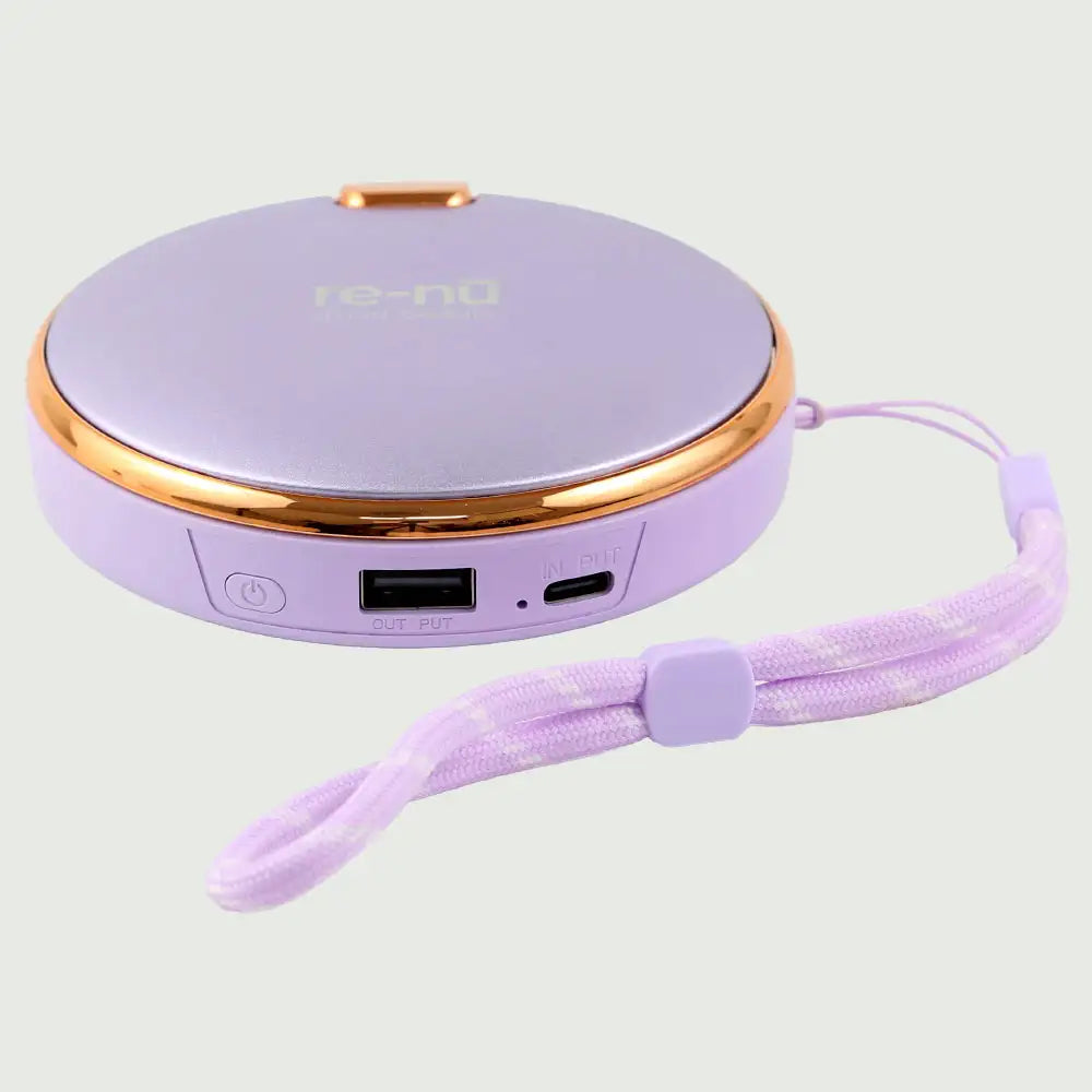 Flat lay of the Purple re-nū Smart Beauty Hand Warmer, showing its USB and USB-C charging ports and soft lanyard strap.