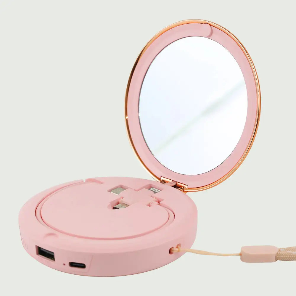 re-nū Smart Beauty Hand Warmer Power Bank displayed in the Pink color option showcasing its compact mirror and versatile charging cable.