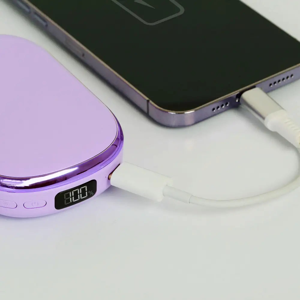 Closeup of the 4-in-1 LED Compact Mirror with Power Bank and Hand Warmer charging a smartphone via built-in 4000mAh power bank