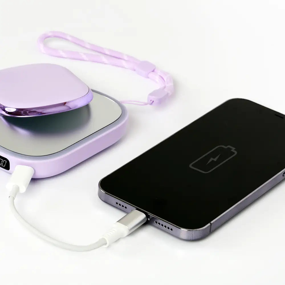 The 4-in-1 LED Compact Mirror with Power Bank and Hand Warmer charging a smartphone via built-in 4000mAh power bank