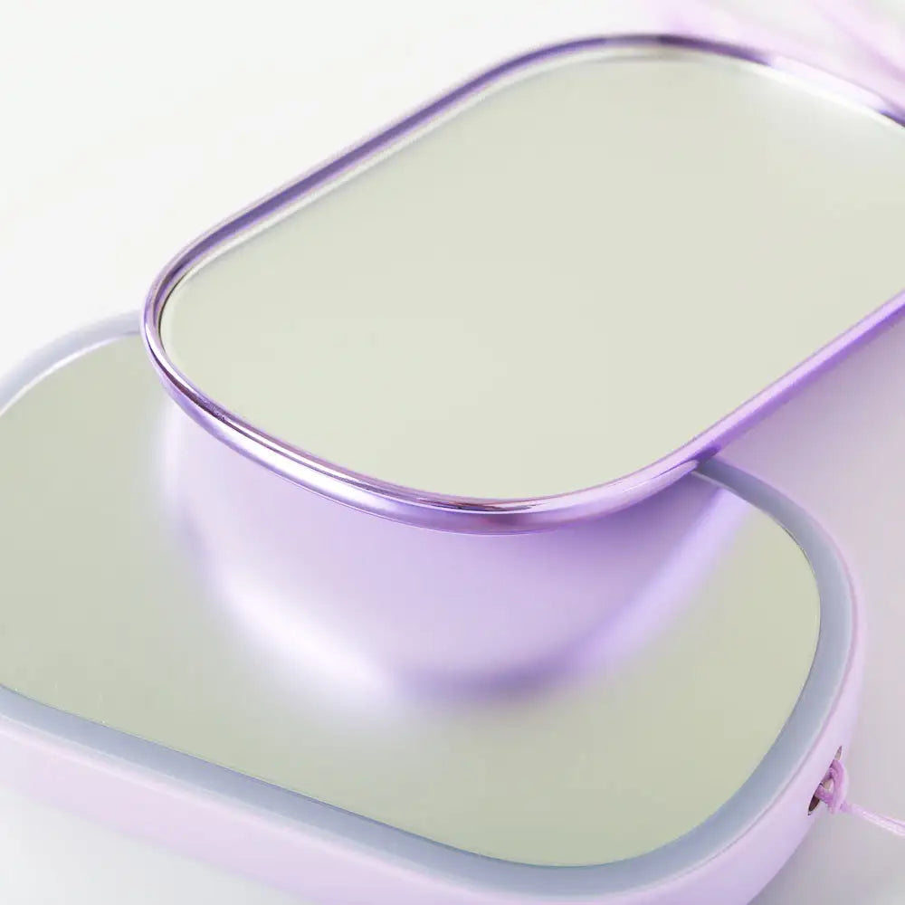 Close-up of magnetic 2X compact mirror and sleek LED trim design, Purple version