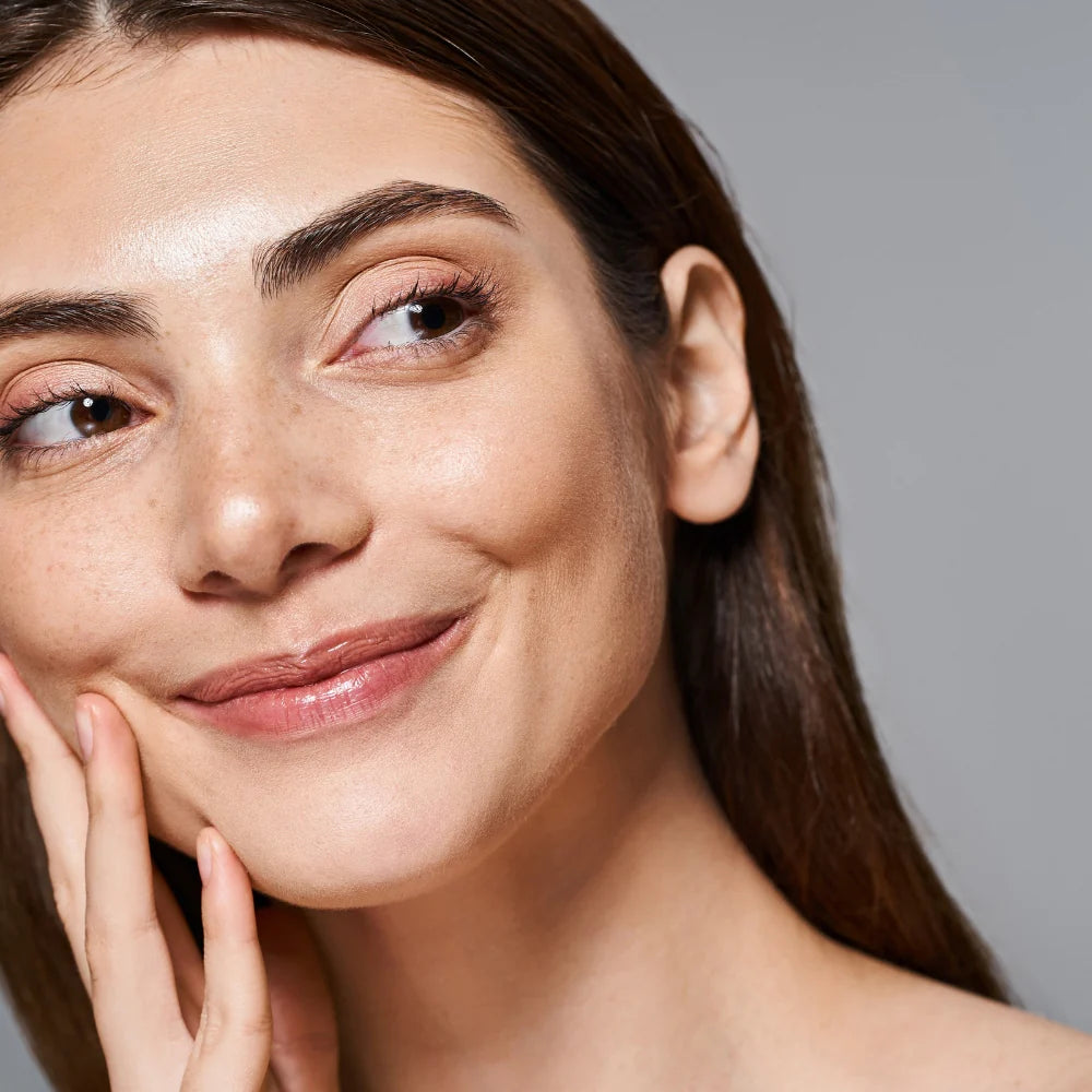 Woman deep cleansing her pores with Ultrasonic Scrubber on nose and chin area.