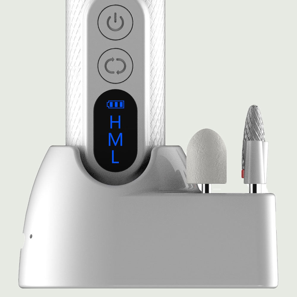 Close-up of re-nū Smart Beauty 7-in-1 Nail Drill base with LED speed display, soft-touch controls, and interchangeable manicure bits for shaping and polishing