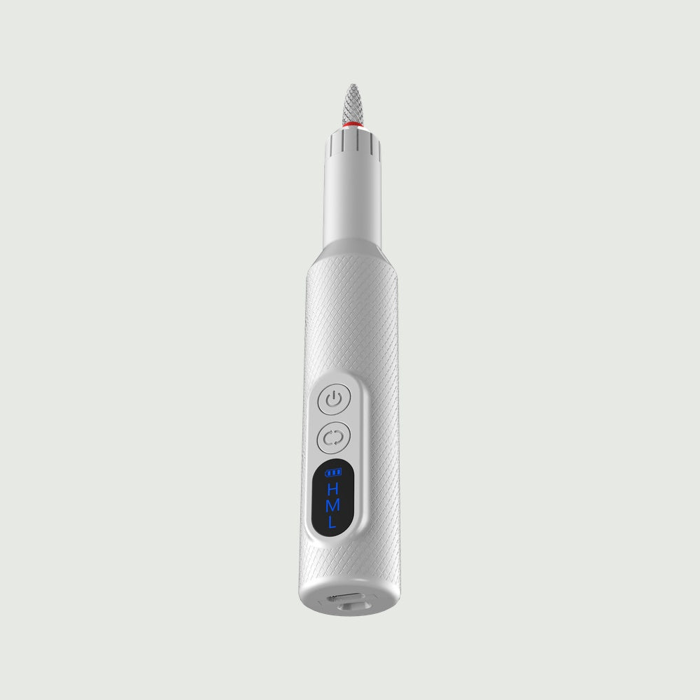 Handheld view of re-nū Smart Beauty 7-in-1 Electric Nail Drill with textured grip, LED display, and attached polishing bit for professional manicure results