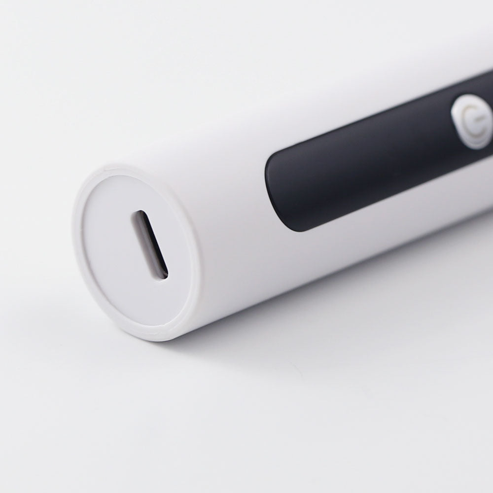 Zoomed-in close-up of the USB charging port on the re-nū Dual Motion Electric Nail Drill, highlighting its sleek, rechargeable design.