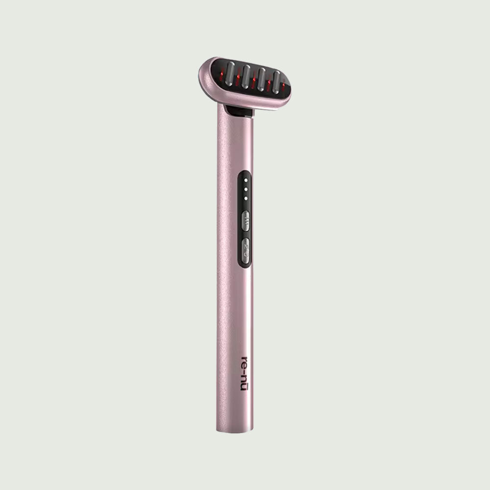 Full view of the LED Light Therapy Wand in pink color with red light glowing from the treatment head, highlighting its active red light therapy function for anti-aging skincare.