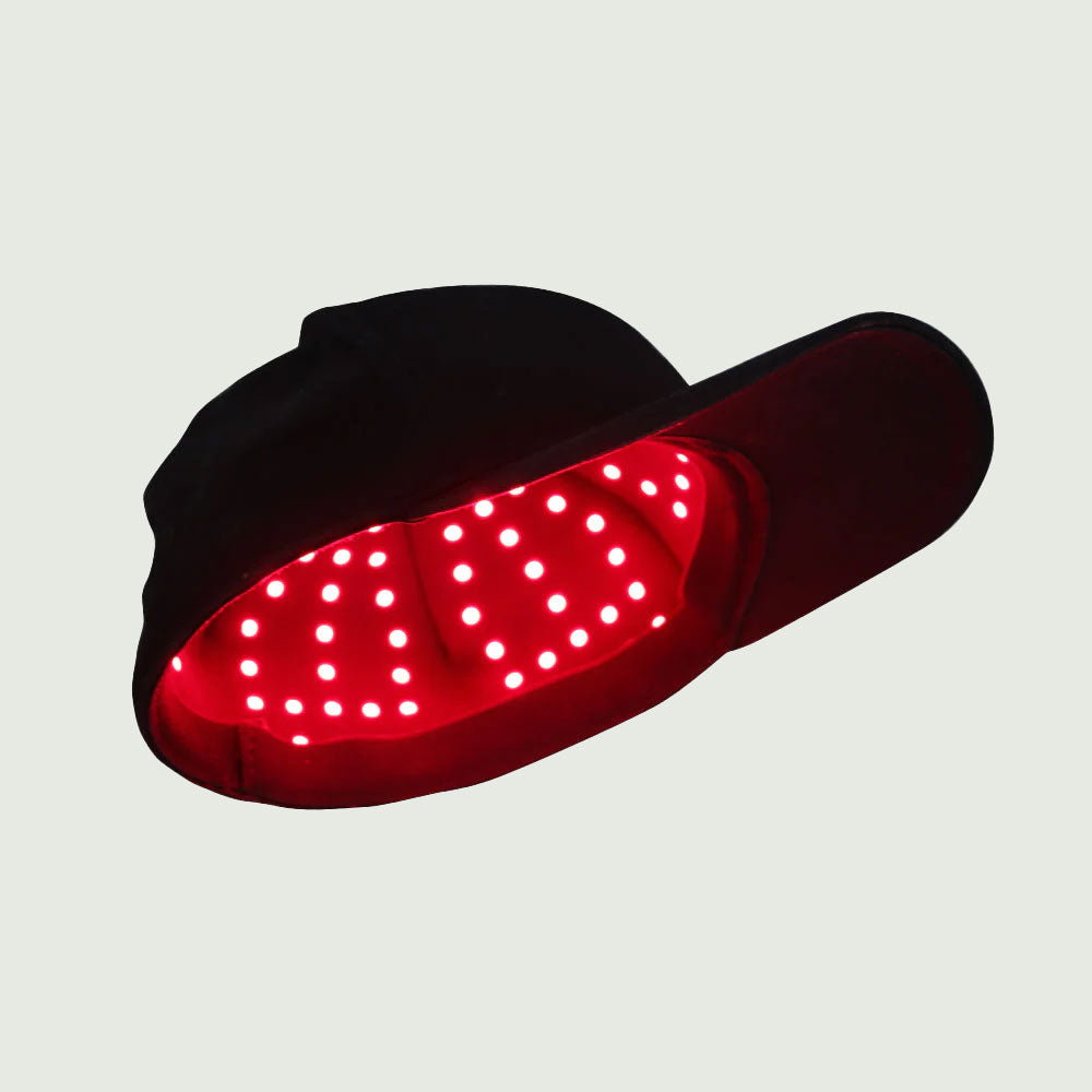 Angled view of red light cap emphasizing soft, ergonomic design for comfortable daily use