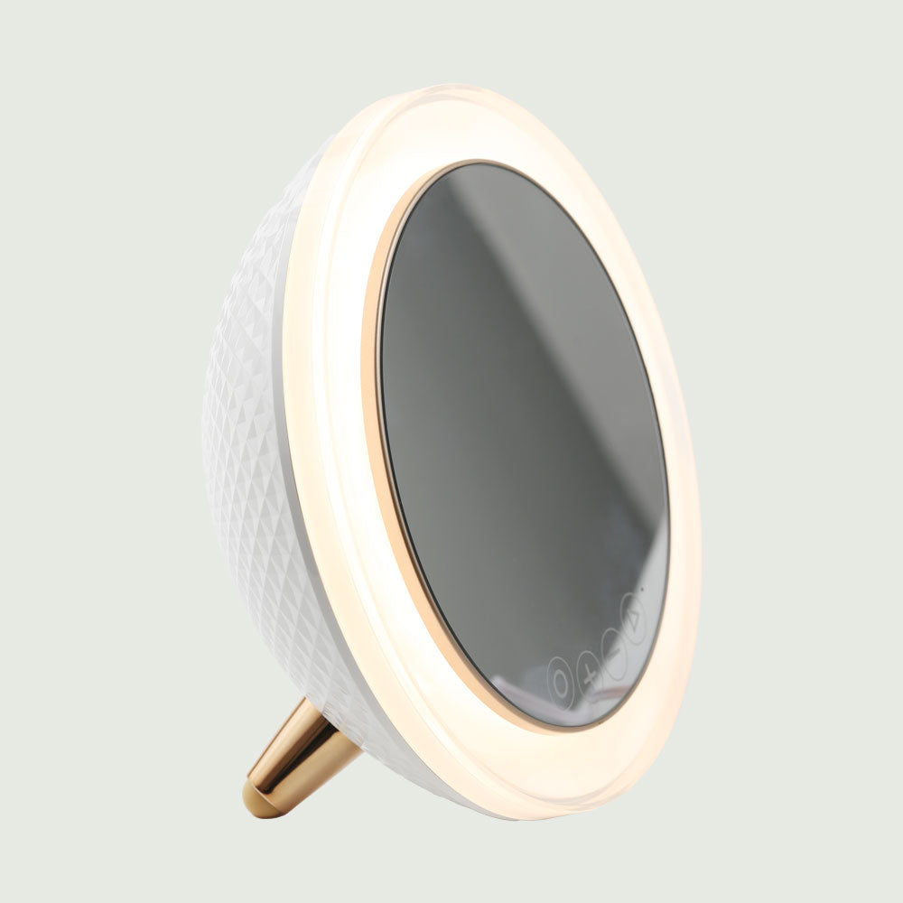 LED Ring Light Bluetooth Mirror from re-nū Smart Beauty, featuring a circular illuminated frame and integrated Bluetooth speakers for enhanced makeup application and multimedia functionality.