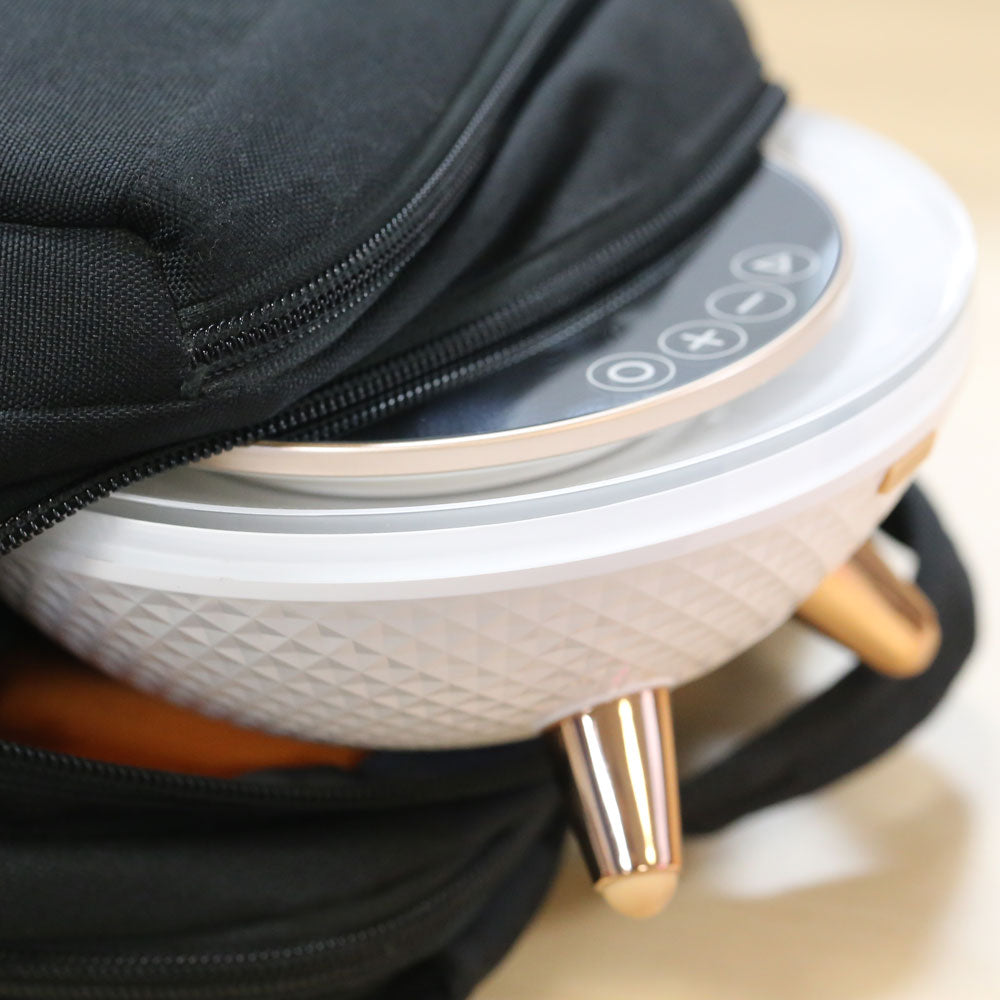 LED Ring Light Bluetooth Mirror from re-nū Smart Beauty being placed into a travel bag, highlighting its compact, portable design for beauty routines on the go