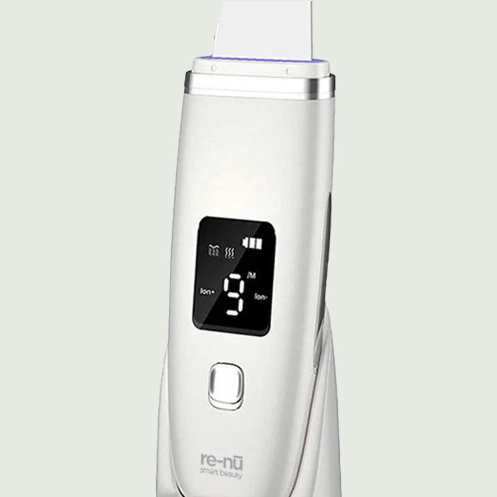 Close-up of Ultrasonic Facial Scrubber with curved metal spatula tip.