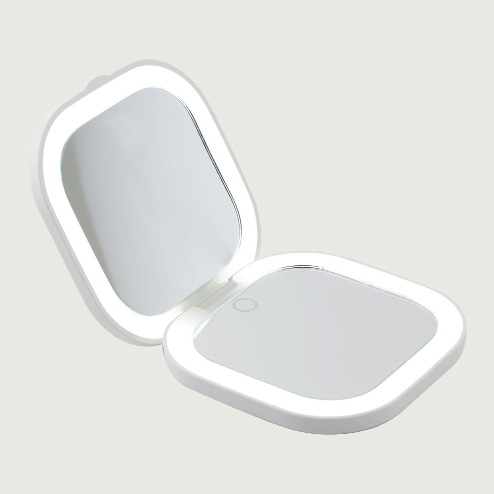 Open view of the Compact LED Pocket Mirror from re-nū Smart Beauty, featuring built-in cool LED lighting and a sleek, portable design