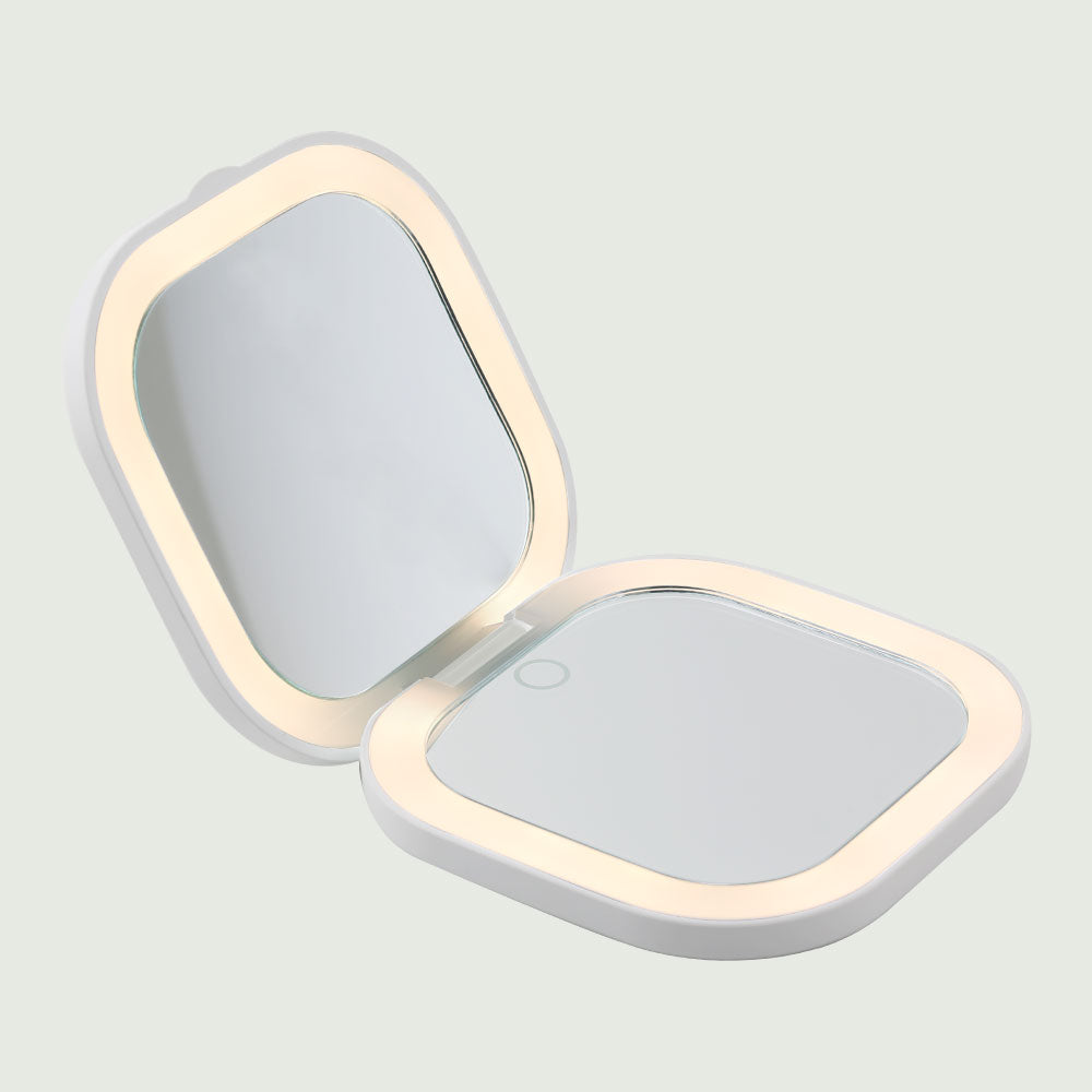 The Compact LED Pocket Mirror opened with bright, natural LED lights illuminating for enhanced visibility.