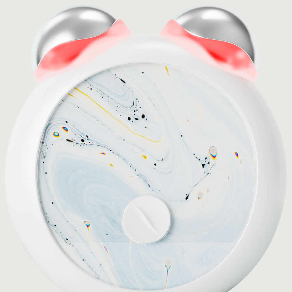 Close-up view of the compact LED Facial Toning Massager; front view showing the smooth, ergonomic design with visible LED light and High-Frequency Microcurrent EMS massage rollers.