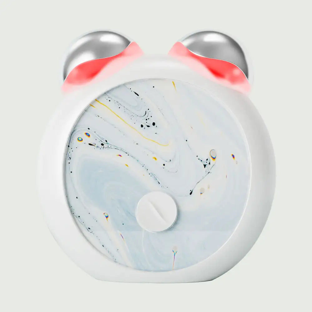 Front view of Compact LED Facial Toning Massager from re-nū Smart Beauty showing sleek, ergonomic shape and dual LED light area
