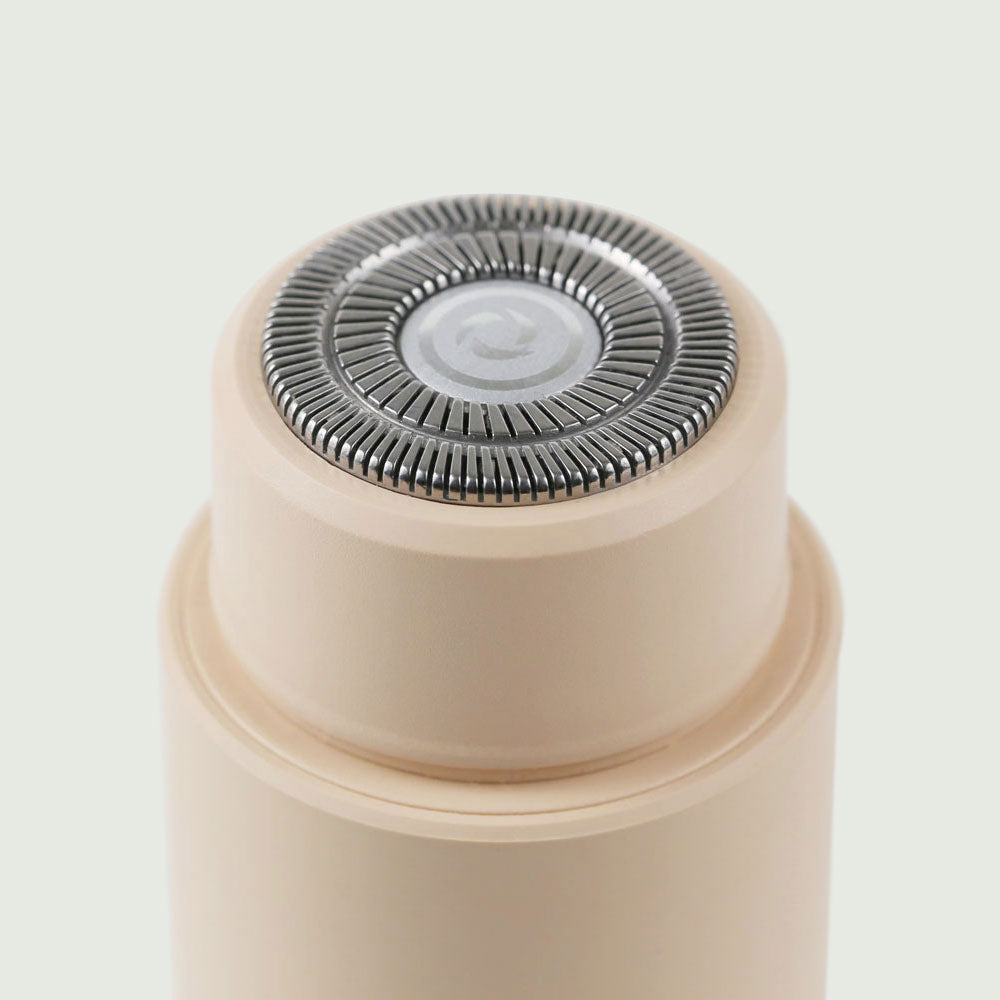 Close-up View of the Double-Headed Personal Grooming Trimmer, highlighting the stainless steel 3D floating flex head for a close, comfortable shave.