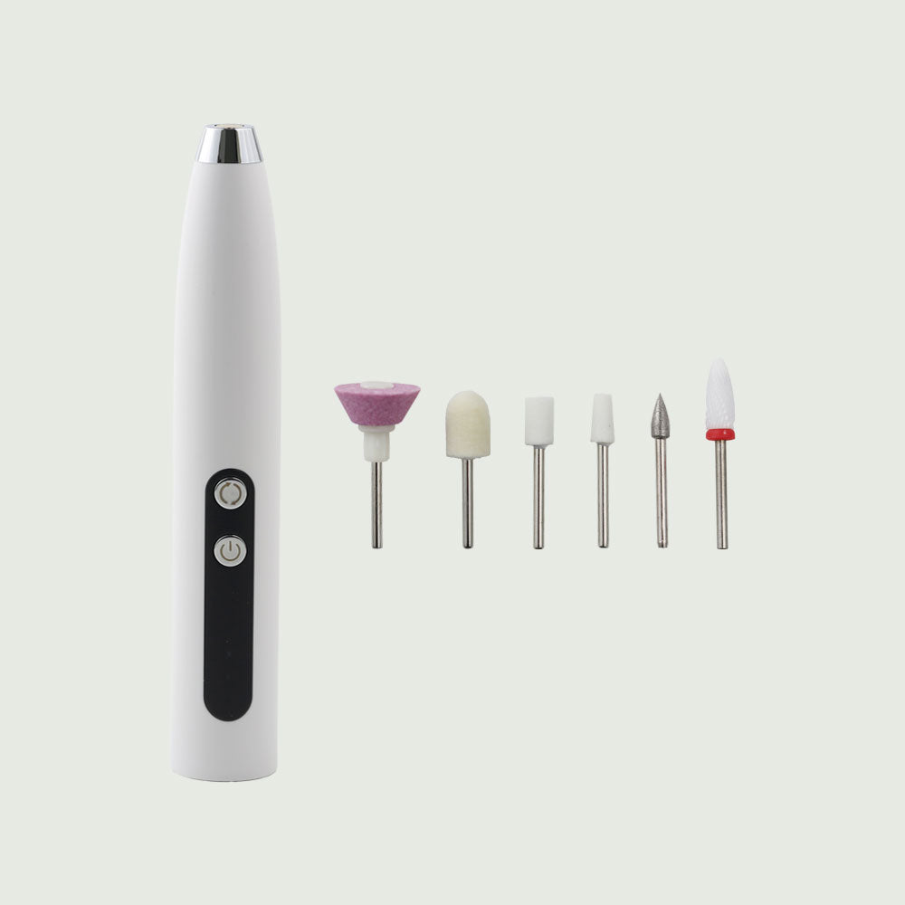 Flat lay image of the re-nū Dual Motion Electric Nail Drill alongside all six interchangeable drill bits, showcasing its full precision manicure toolset.