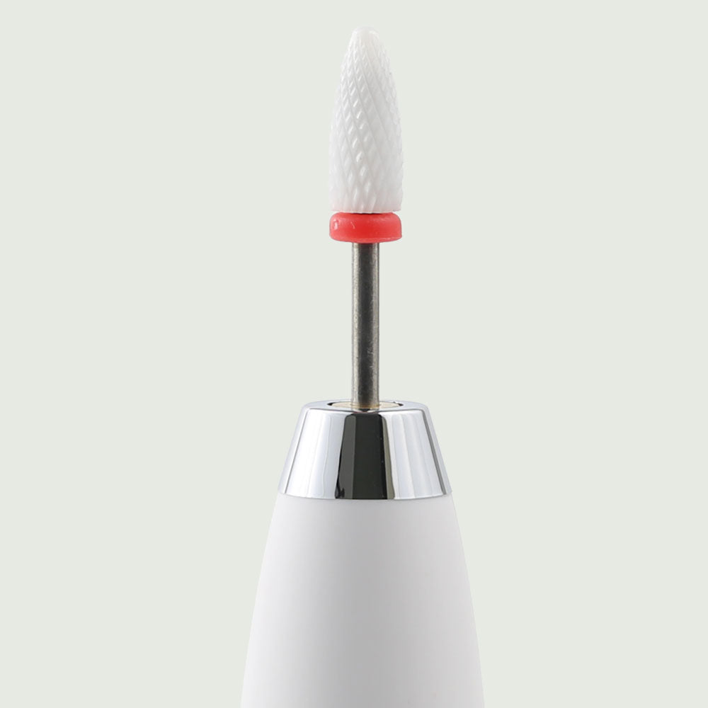 Close-up of the re-nū Dual Motion Electric Nail Drill, highlighting the sleek pen-style body, precision tip, and textured grip for controlled handling.