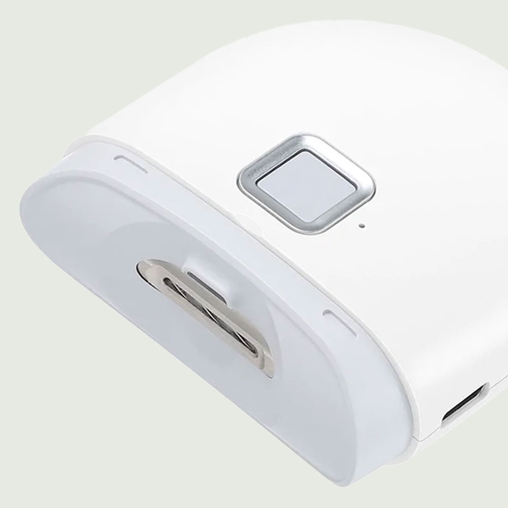 Close-up of Electric Nail Trimmer showing ergonomic grip and protective trimming head designed for safe, precise grooming