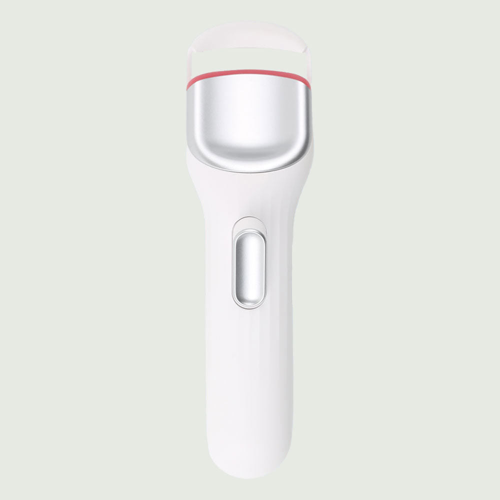 Re-nū Smart Beauty Heated Eyelash Curler in a sleek white and silver design, featuring a slim handle and curved heated comb for precise lash curling.
