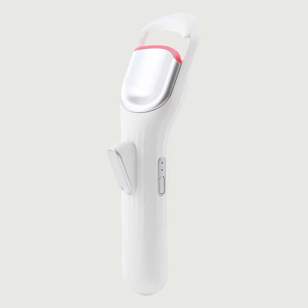 re-nū Smart Beauty Heated Eyelash  Curler with sleek ergonomic design on display