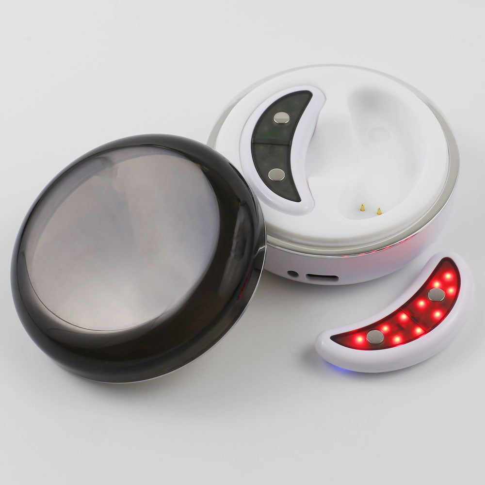 Closeup of the GlowUp LED/EMS Under Eye Anti Aging Pads and charging case, designed with red light therapy and gentle EMS technology.