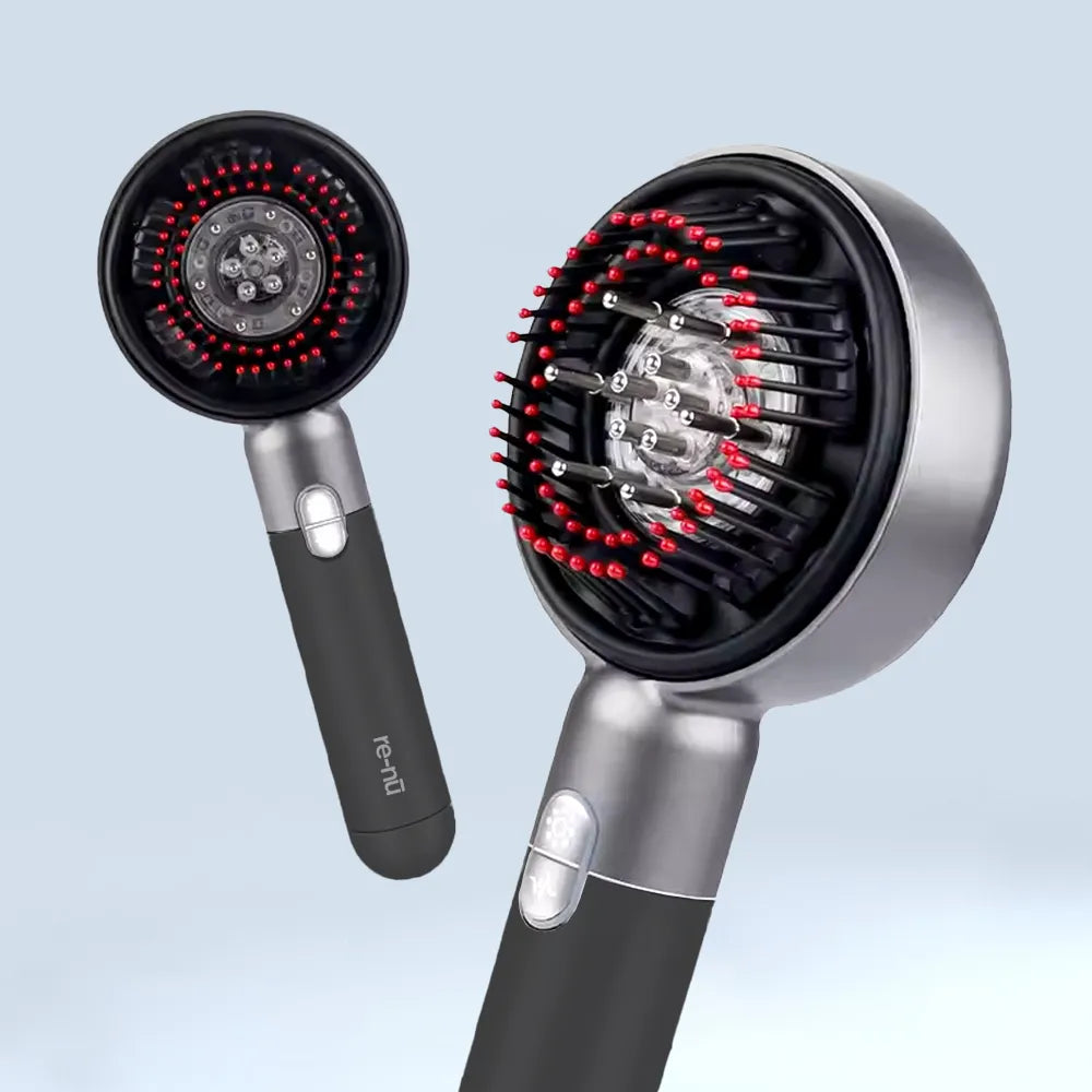 LED red light therapy scalp massager comb with bristle tips, designed for hair growth stimulation and scalp rejuvenation by re-nū.