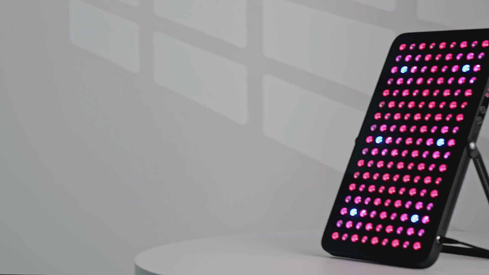 Load video: Video of the UltraThin LED Red Light Therapy Panel shown in-use, with 360 degree spin and working LED display