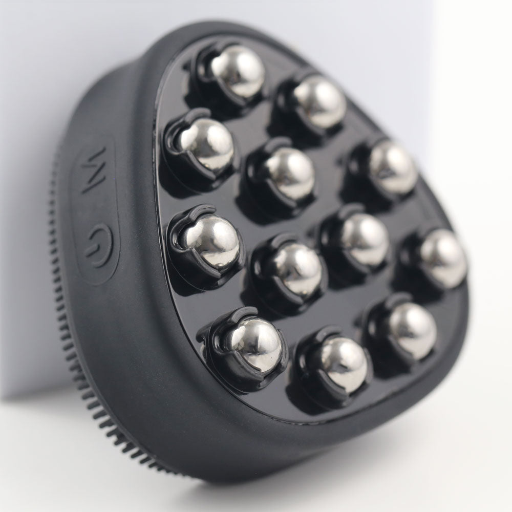 Close-up view of the PurePulse Pro Sonic Cleansing Brush in black, highlighting 12 stainless steel massage nodes and side power/mode buttons for facial toning and skincare therapy.