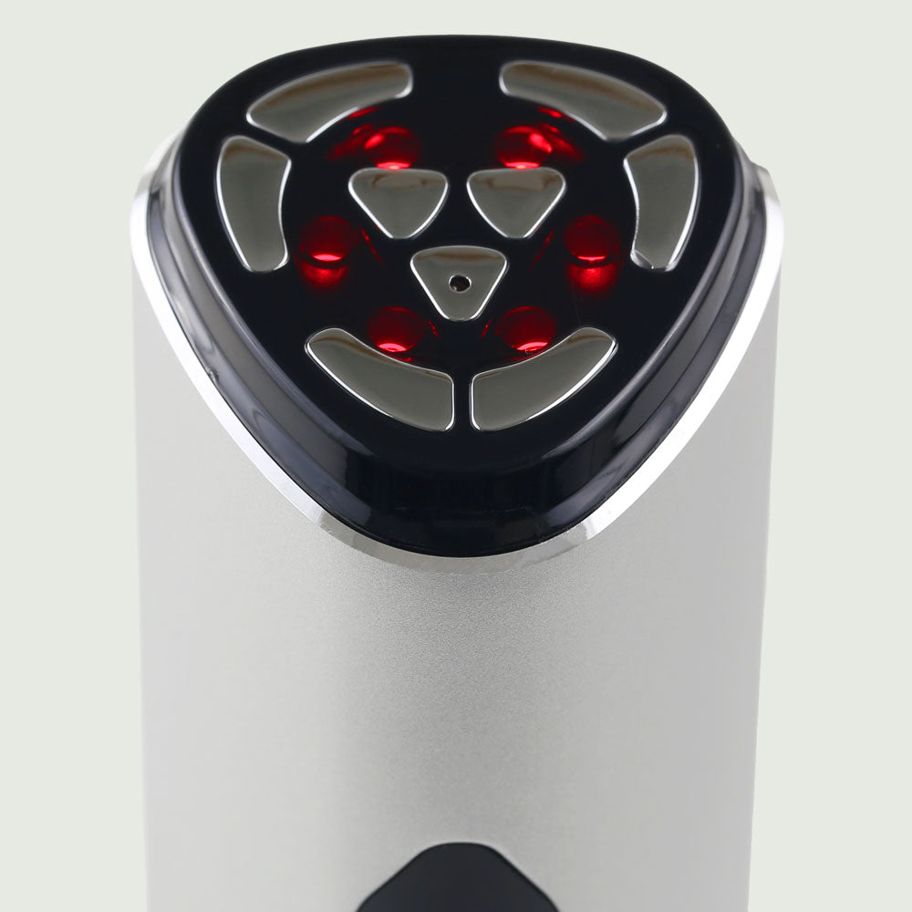 Close-up of the treatment head on the re-nū RF LED Microcurrent Face-Lifting Device, highlighting the smooth metal contact points and built-in LED light nodes for precise skin therapy.