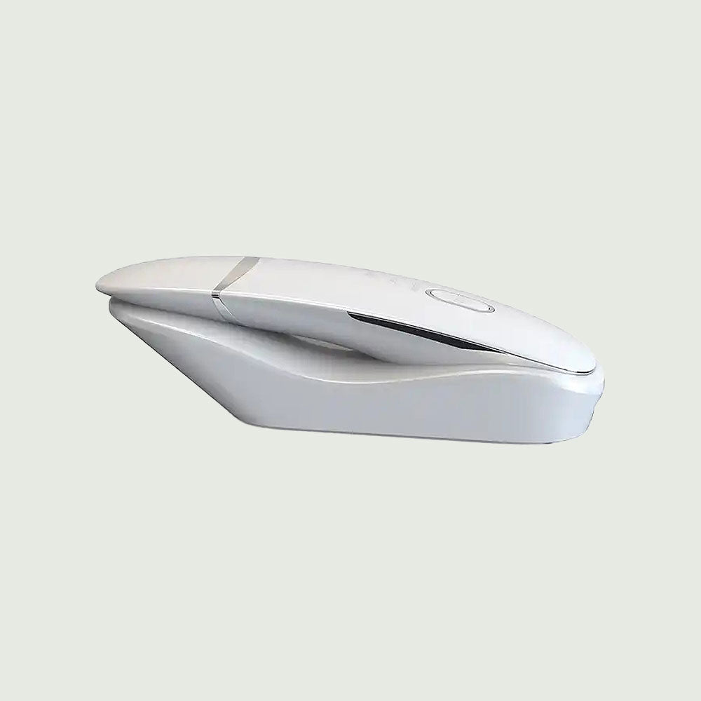 A white Ultrasonic Scrubber mouse positioned on a blue surface, highlighting its sleek design and modern technology.