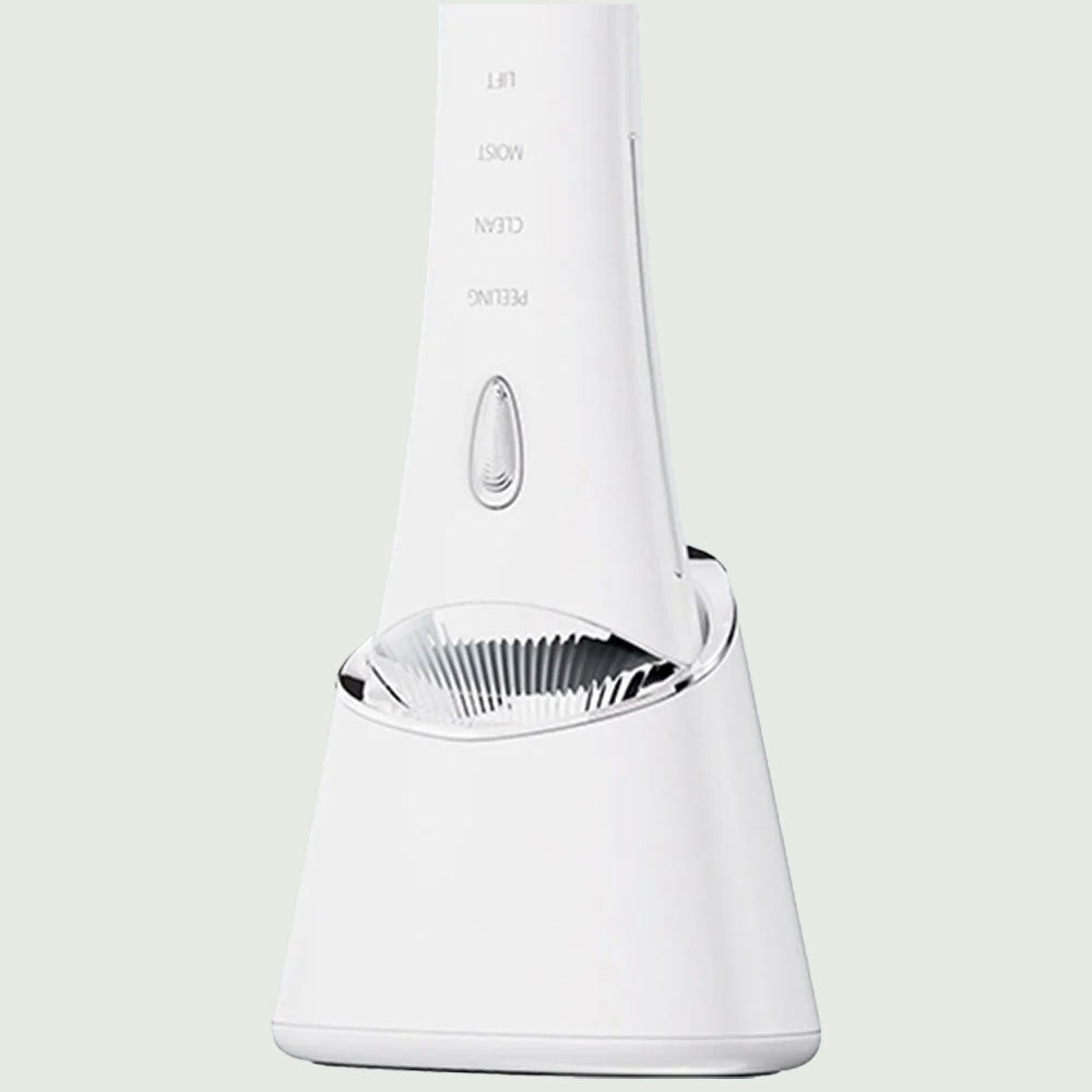 Detail view of the UV base for the Ultrasonic Skin Scrubber, highlighting the wireless charging feature with the device docked.