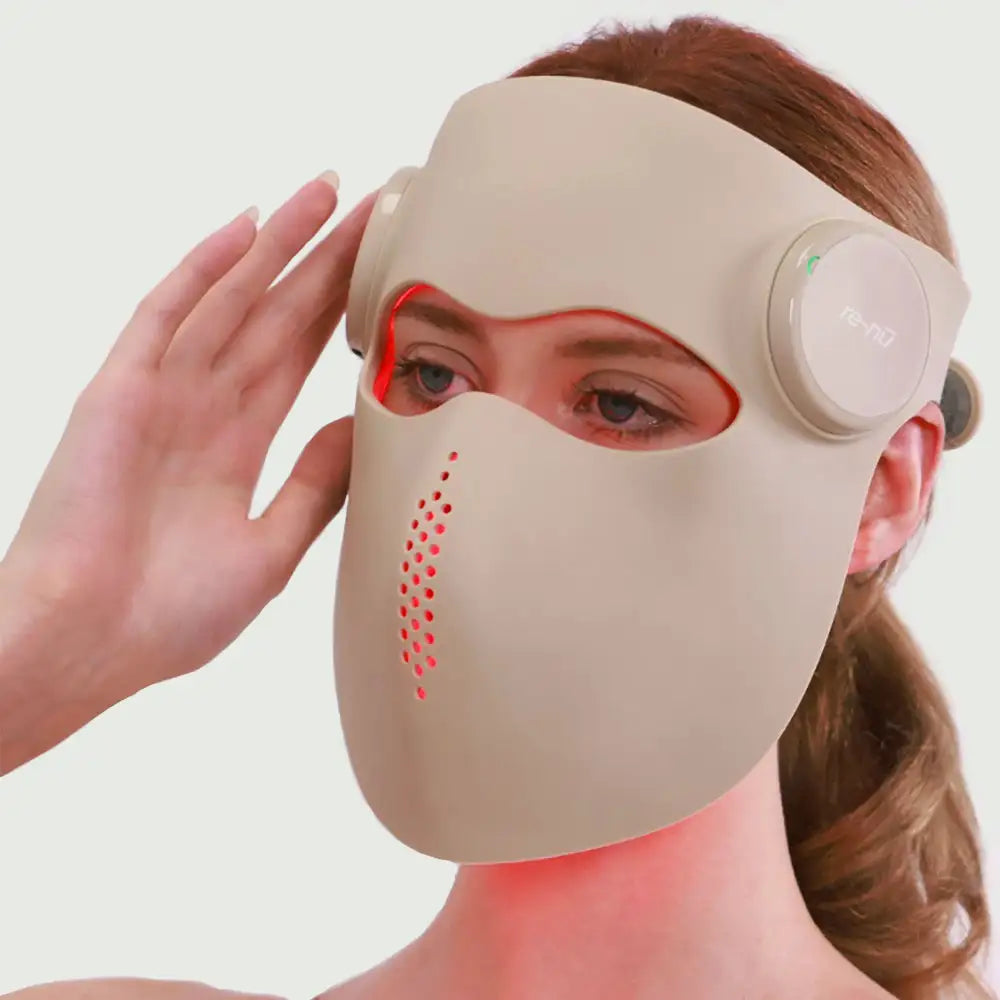 Woman wearing the 5D Mask Laser Mask during a skincare routine.