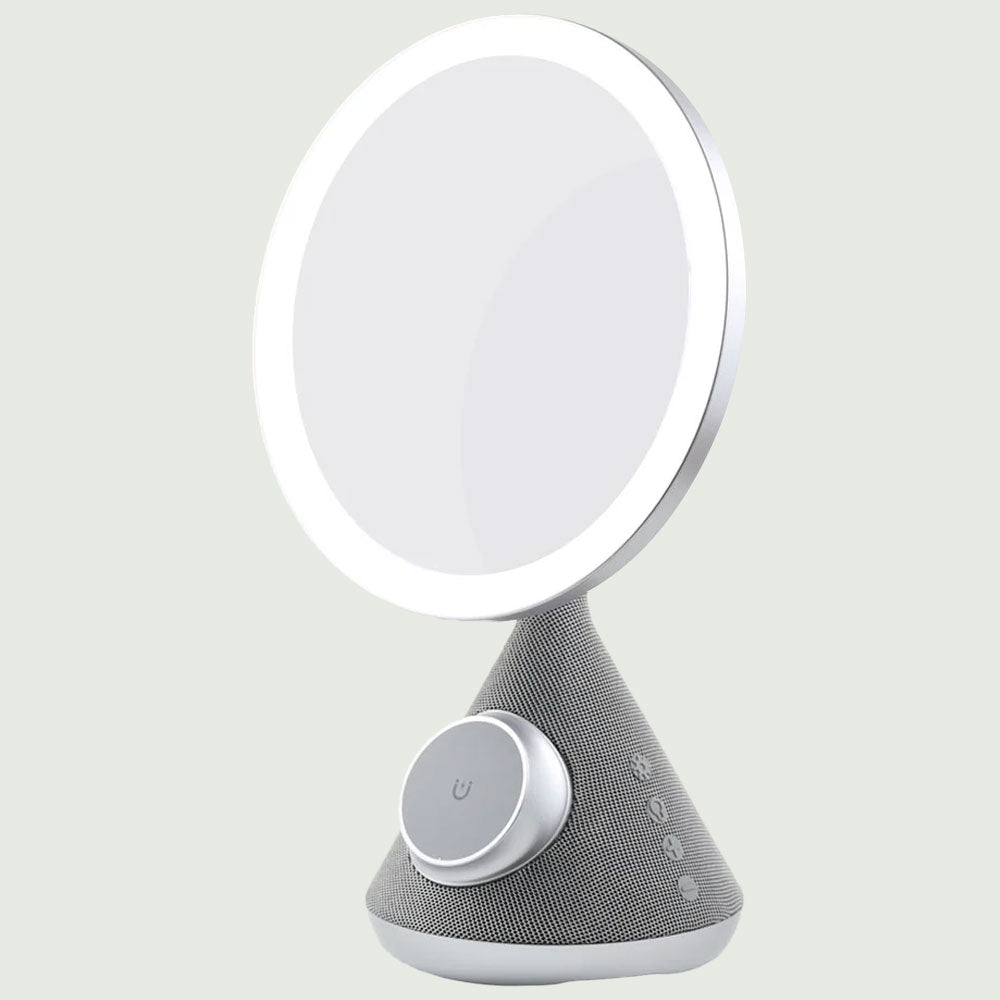 Side-angleof the re-nū 3-in-1 Smart Beauty Mirror with LED ring visible and touch controls shown.