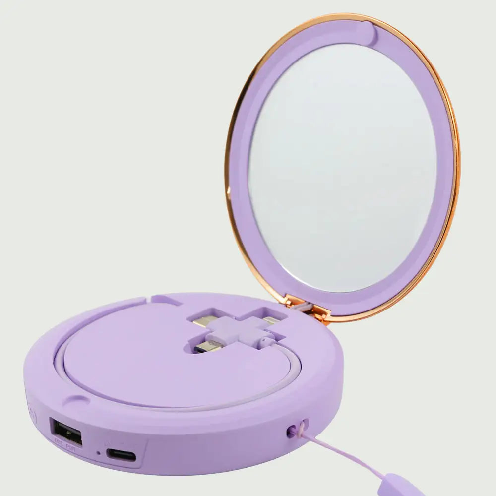 re-nū Smart Beauty Hand Warmer Power Bank displayed in the Purple color option showcasing its compact mirror and versatile charging cable.