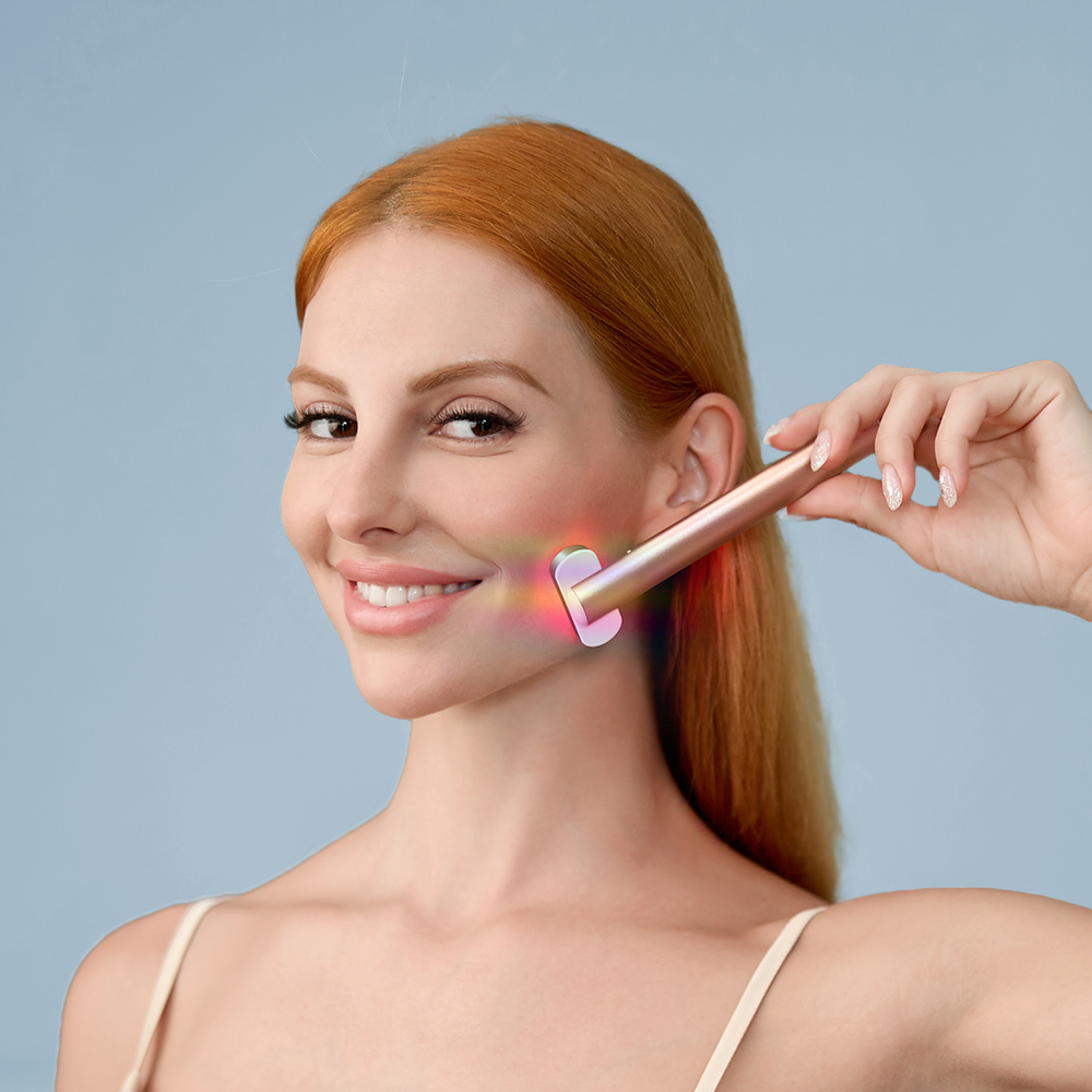 A woman holds a toothbrush equipped with a light, showcasing the innovative Mask LED Light Therapy feature.