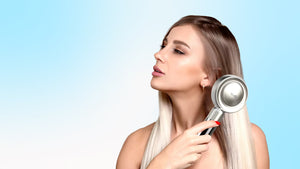 A woman using a brush on her hair, illustrating the principles of the Hair Cong Red Light Theory.