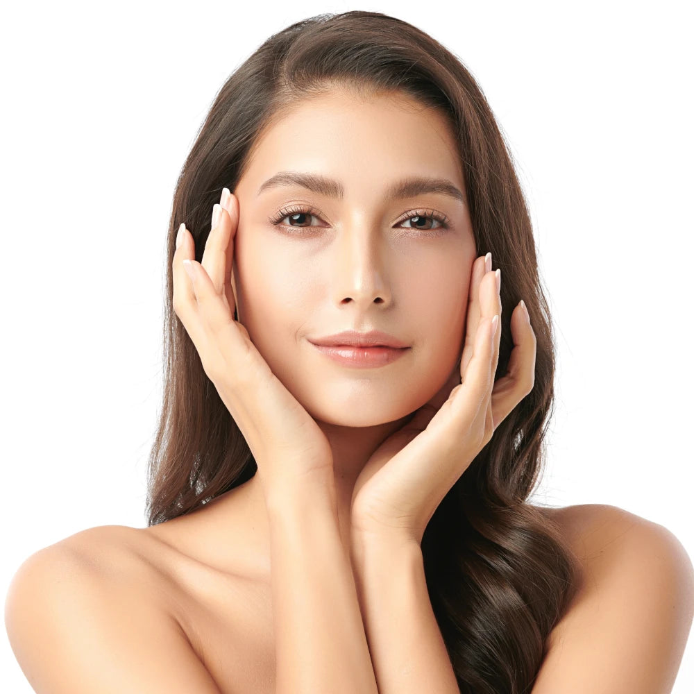 Joyful woman with hands gently placed on her cheeks, showcasing lifted, radiant skin after using the Compact LED Facial Toning Massager from re-nū Smart Beauty