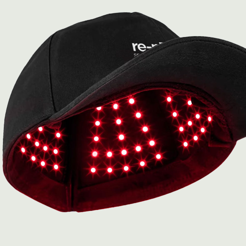 Close-up of re-nū Smart Beauty red light therapy cap showing powerful dual LED grid with 660nm and 850nm wavelengths
