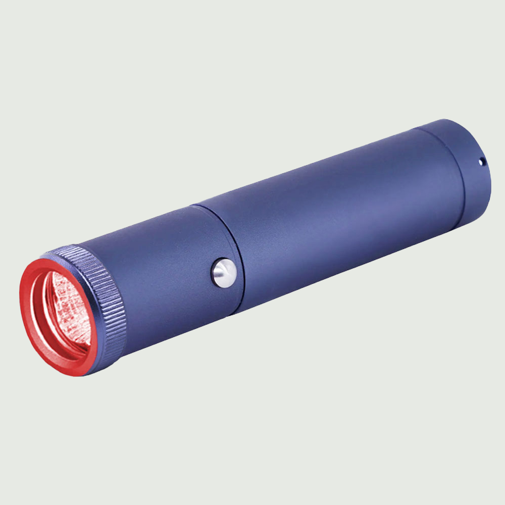 Red Light Therapy Torch with precision fiber optic tip shown at a side angle, highlighting its compact and ergonomic design for targeted skin treatment.

