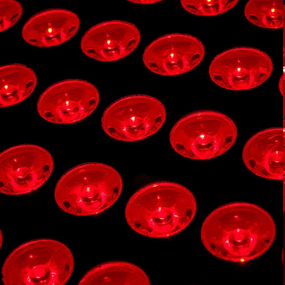 Close-up view of the 360 LED Red Light Therapy Belt showing glowing red and near-infrared LED lights activated, highlighting the dense LED array embedded in the flexible fabric
