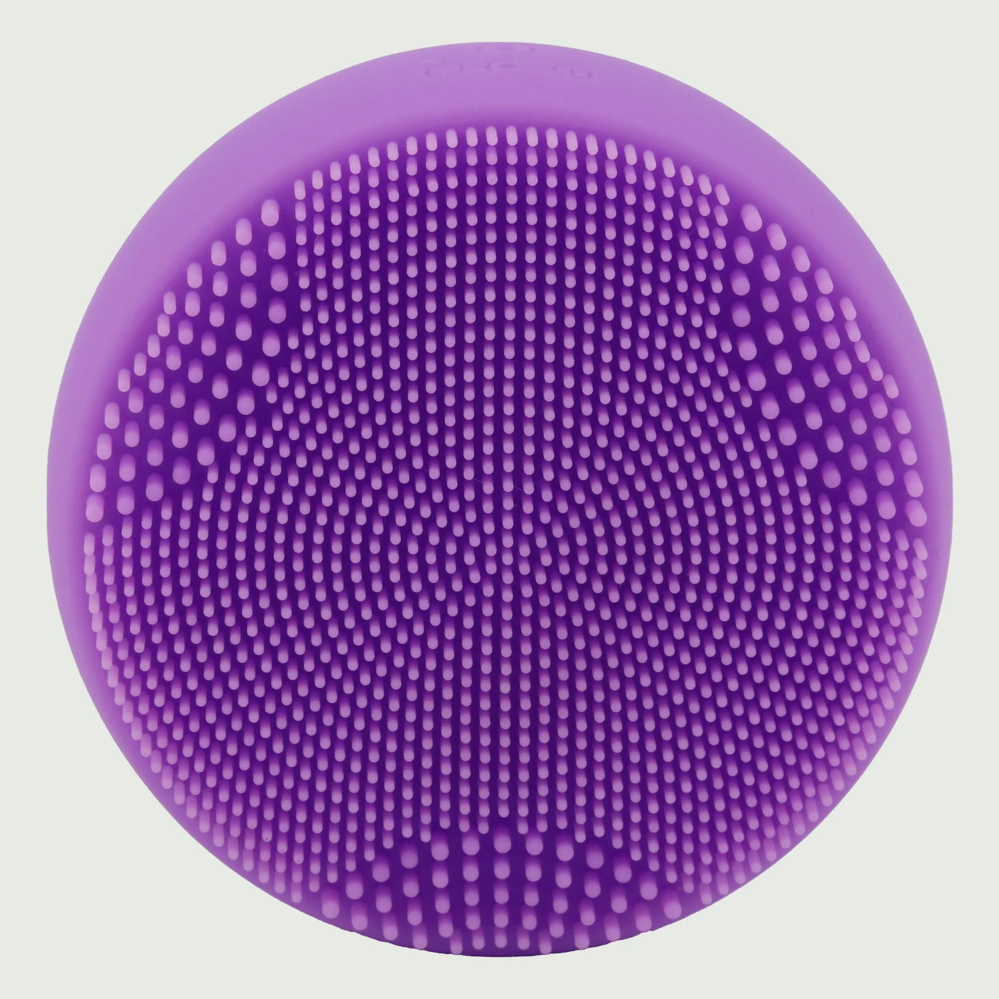 PurePulse Pro Plus Sonic Cleansing Brush shown in forward facing view highlighting soft silicone bristle surface, ergonomic contours, premium finish, and compact profile