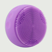 PurePulse Pro Plus Sonic Cleansing Brush shown in 3/4 view highlighting soft silicone bristle surface, ergonomic contours, premium finish, and compact profile
