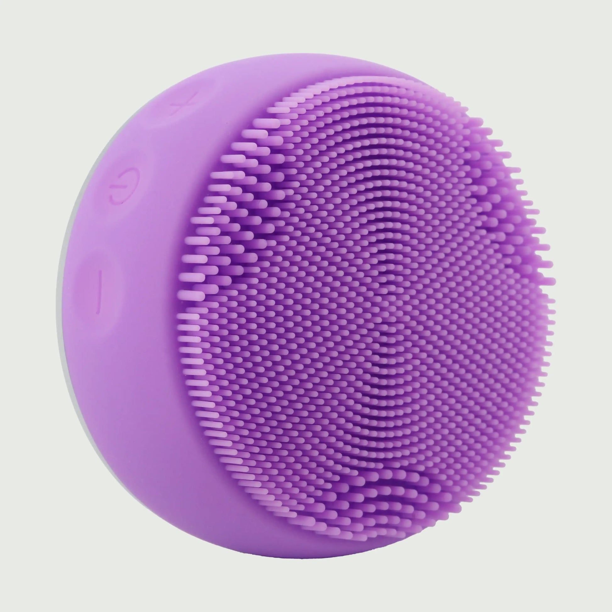 PurePulse Pro Plus Sonic Cleansing Brush shown in 3/4 view highlighting soft silicone bristle surface, ergonomic contours, premium finish, and compact profile