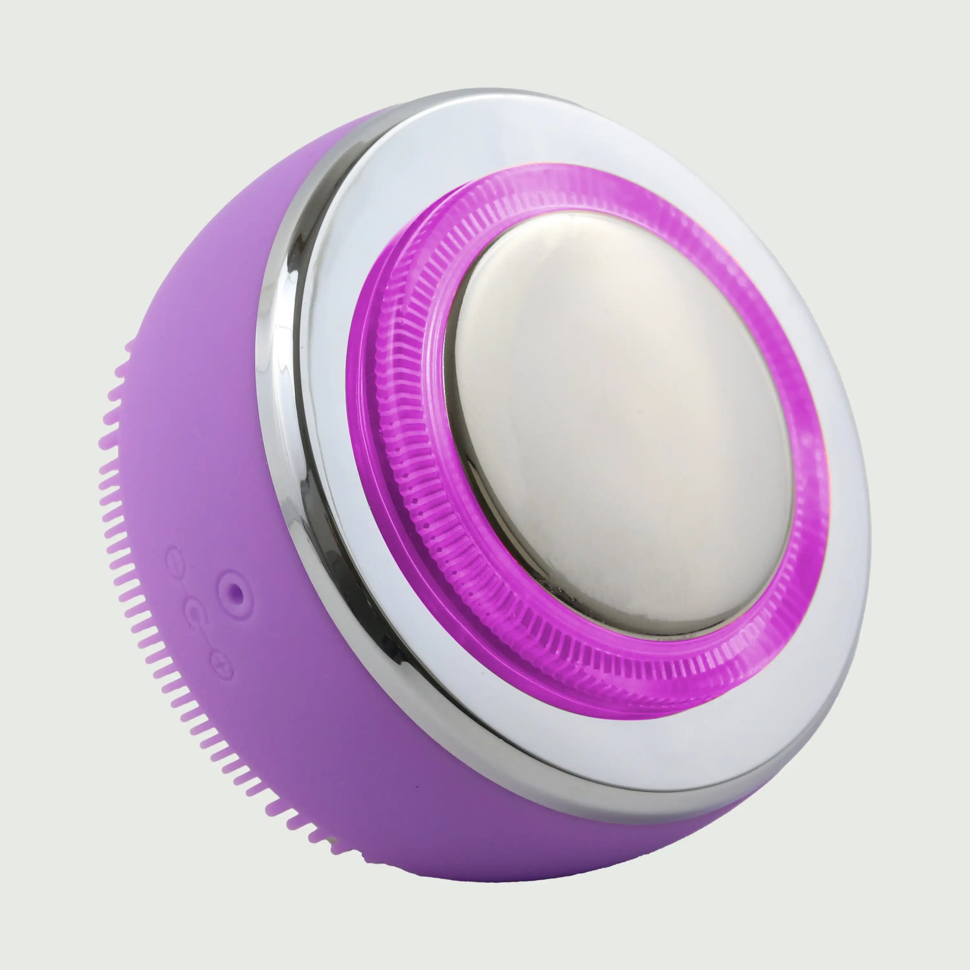 PurePulse Pro Plus Sonic Cleansing Brush in 3/4 view featuring purple LED illumination, reflective chrome EMS head, soft-touch silicone bristles, and modern handheld silhouette