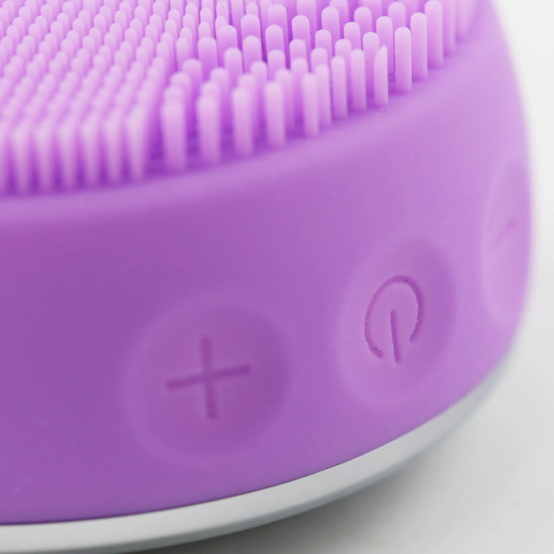 Close-up of PurePulse Pro Plus control interface showing ergonomic button layout, smooth finish, intuitive controls, and illuminated operating indicators