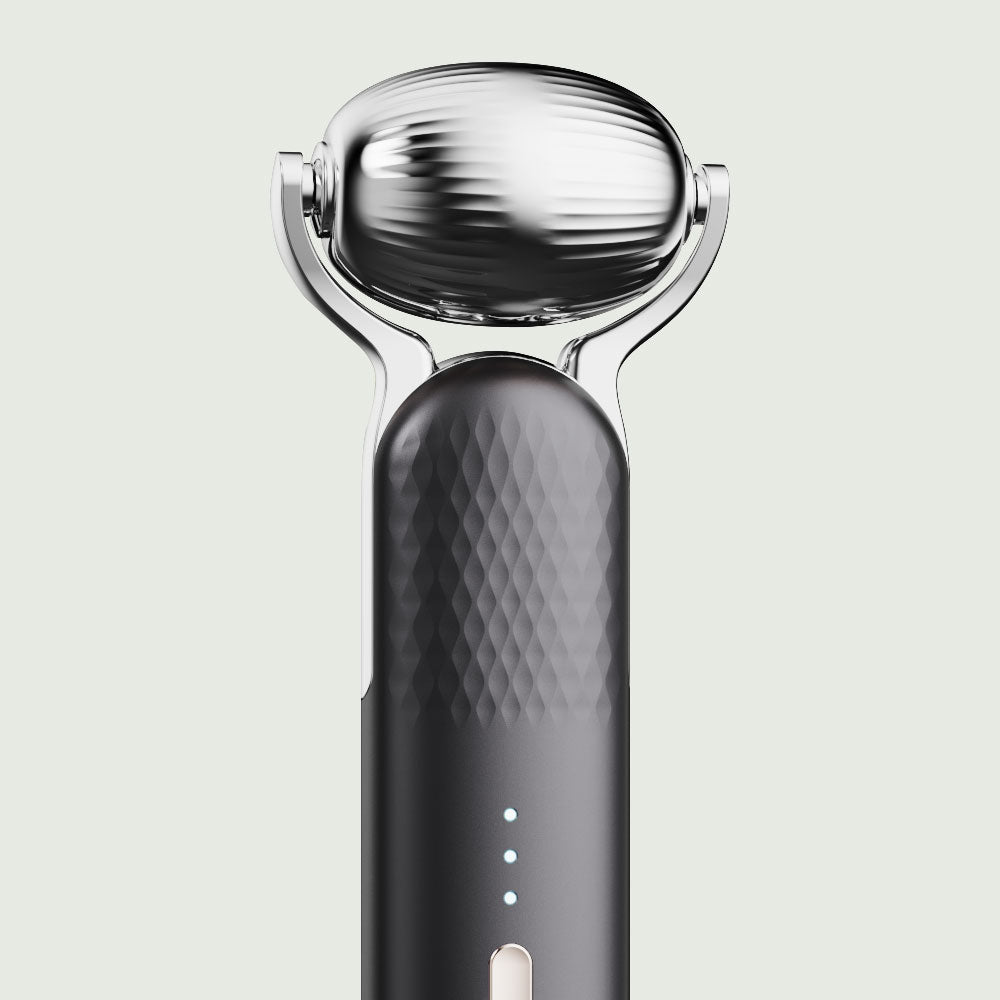 Close-up of the wide Cryo roller head on the re-nū Cold Therapy EMS Dual Roller, designed to soothe, de-puff, and tighten skin with instant cooling therapy.